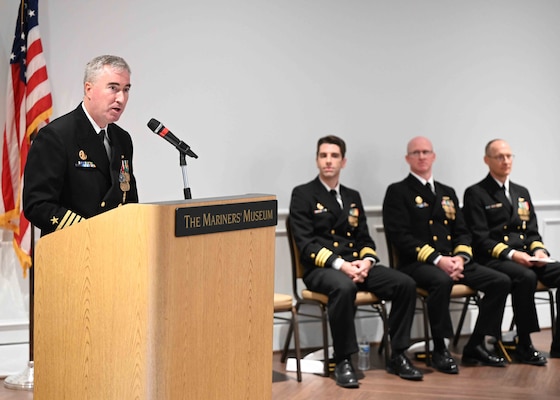 Capt. Brian Hogan, commodore, Submarine Squadron Eight, speaks as the presiding officer during a change of command ceremony for the Los Angeles-class fast-attack submarine USS Columbus (SSN 762) at the Mariner’s Museum and Park in Newport News, Virginia.