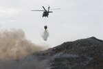 Virginia Guard helicopter crew helps firefighters battle fire at Henrico landfill
