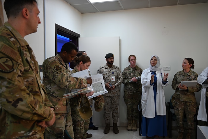 U.S. Airmen from the 378th Expeditionary Medical Squadron (EMDS) listen to a nurse from a local hospital during Operation Agile Spartan 23.2, Kingdom of Saudi Arabia, Aug. 22, 2023. 378th EMDS Airmen visited a local area hospital as part of a familiarization tour to assess the medical infrastructure within the exercise area. Agile Spartan 23.2 is a multinational operation aimed at strengthening interoperability, improving response capabilities, and furthering security cooperation initiatives throughout the U.S. Central Command area of responsibility. (U.S. Air Force photo by Capt. Marie Ortiz)