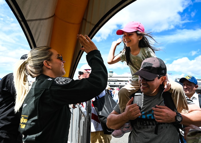 U.S. Air Force Capt. Aimee “Rebel” Fiedler, F-16 Viper Demonstration Team commander and pilot, meets an air show attendee during F-AIR Colombia International Aeronautics and Space Fair at José María Córdova Airport in Rionegro, Colombia, July 16, 2023. The U.S. is an enduring, committed partner with robust engagement in Colombia and throughout Latin America and the Caribbean. (U.S. Air Force photo by Staff Sgt. Madeline Herzog)