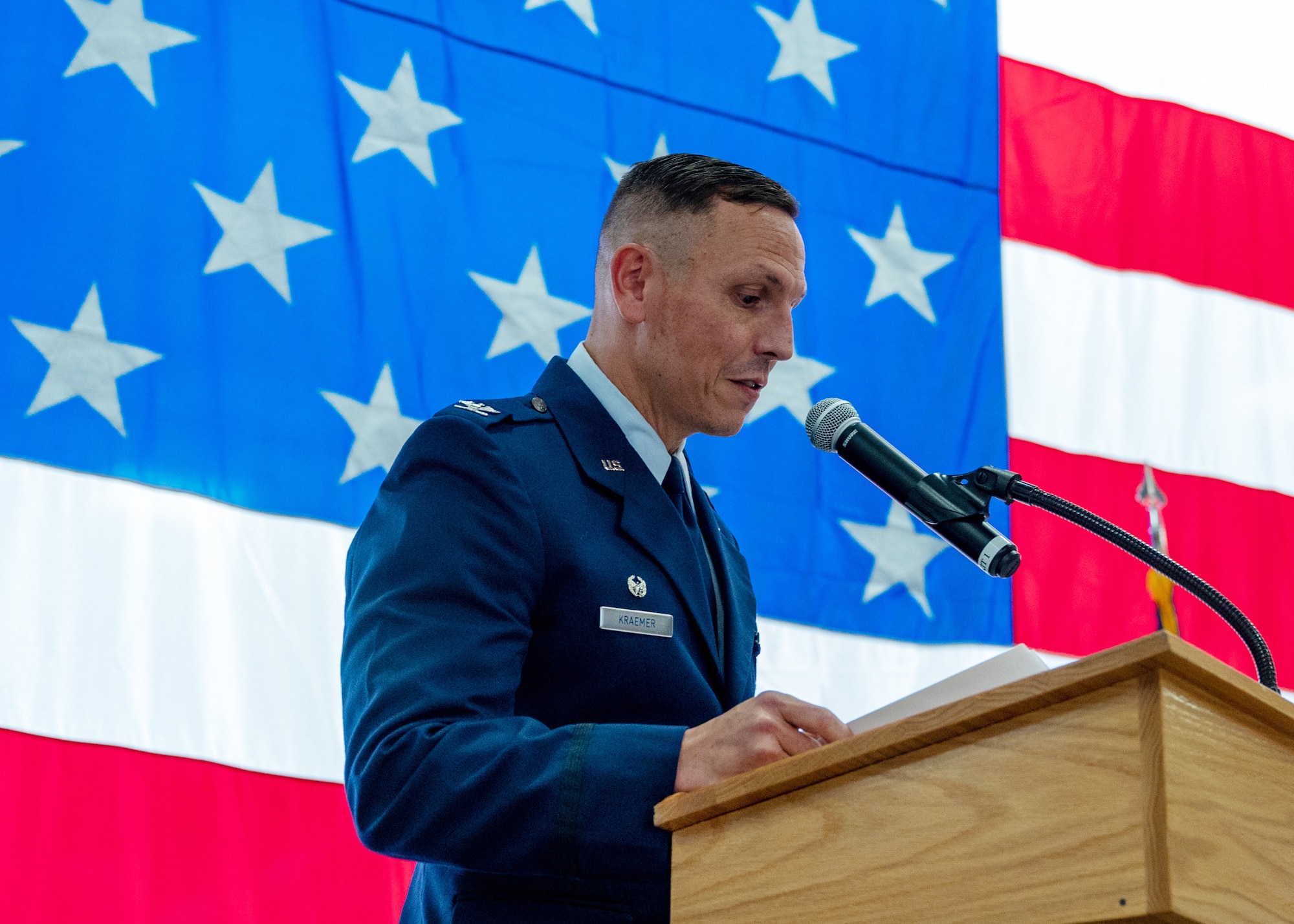 Col. Samuel Kraemer, the new 934th Airlift Wing commander, gives a speech at his assumption of command ceremony at the Minneapolis-St. Paul Air Reserve Station, Minnesota, Nov. 5, 2023. Before assuming the command, Kraemer was the commander 934th Operations Group. (U.S. Air Force photo by Senior Airman Matthew Reisdorf)