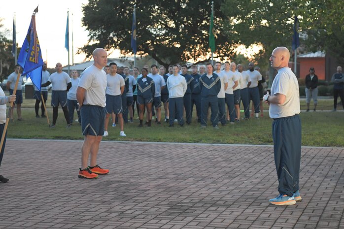U.S. Air Force Chief Master Sgt. David Snarr, 628th Air Base Wing command chief, speaks to Airmen before a wing formation run on Joint Base Charleston, South Carolina, Oct. 20, 2023.
