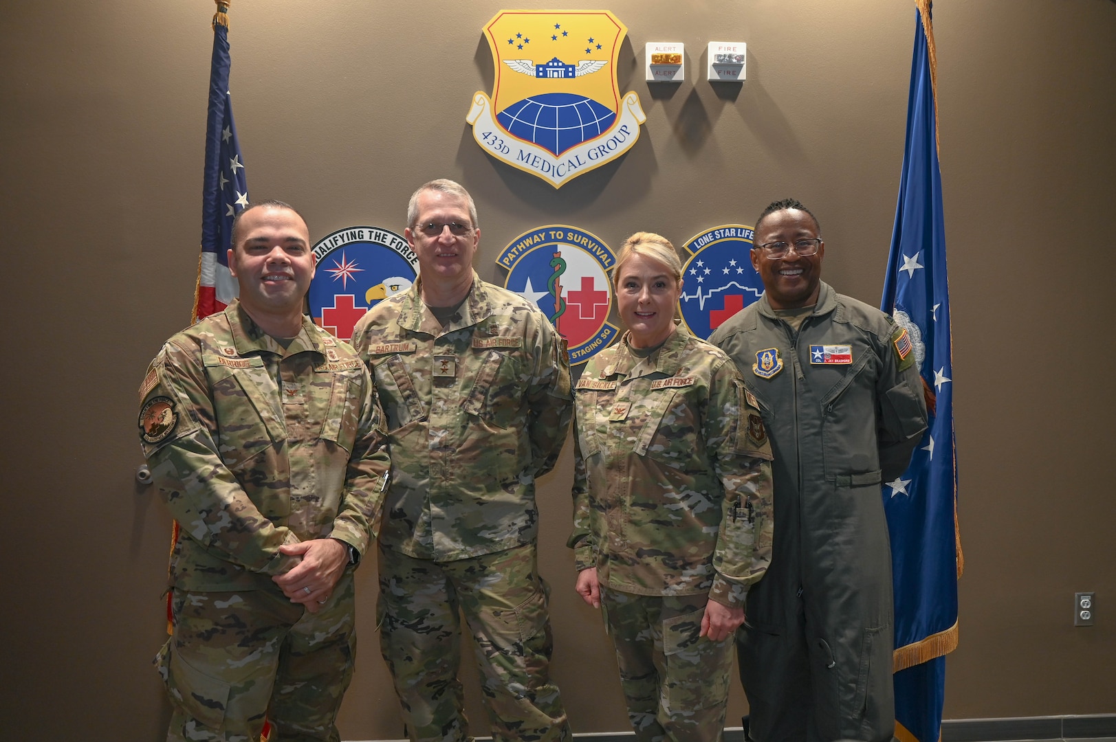 (Left to right) Col. Luis Berrios, 433rd Aerospace Medicine Squadron commander, Maj. Gen. John Bartrum, Mobilization Assistant to the Surgeon General of the Air Force and Space Force, Headquarters U.S. Air Force, Col. Michelle Van Sickle, 433rd Medical Group commander, and Col. Alvin Bradford, 433rd Medical Squadron commander, pose for a photograph at Joint Base San Antonio-Lackland, Texas, Nov. 4, 2023.
