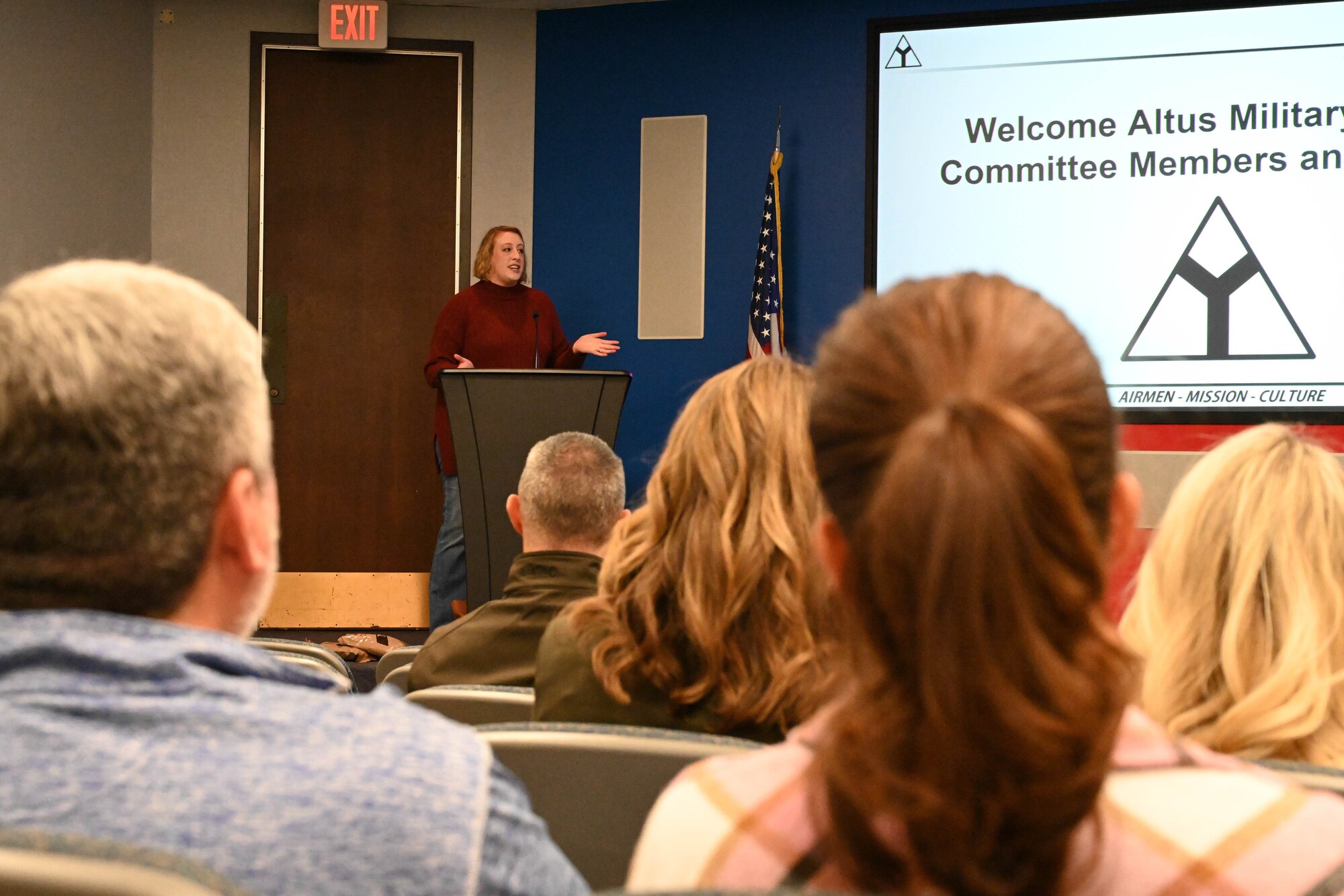 Sydney Doorn, 97th Air Mobility Wing community engagement chief, gives an orientation brief to members of the Altus Military Affairs Committee at Altus Air Force Base, Oklahoma, Nov. 2, 2023. Doorn explained military customs and courtesies as well as provided hands-on activities for the members to participate in. (U.S. Air Force photo by Senior Airman Miyah Gray)