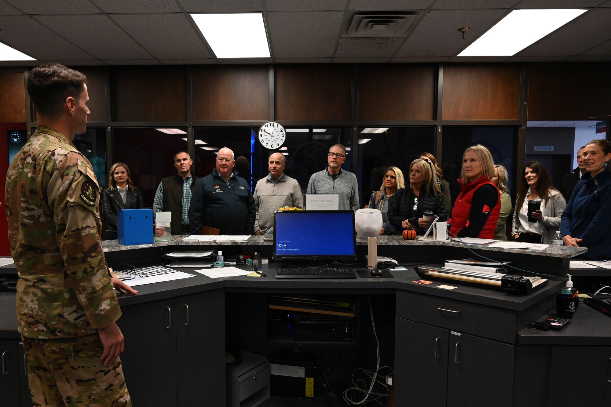 U.S. Air Force Capt. John Silvi, 97th Training Squadron (TRS) student flight commander, speaks to members of the Altus Military Affairs Committee during an orientation tour at Altus Air Force Base, Oklahoma, Nov. 2, 2023. The members interacted with Airmen across the base to learn more about the base and culture. (U.S. Air Force photo by Senior Airman Miyah Gray)