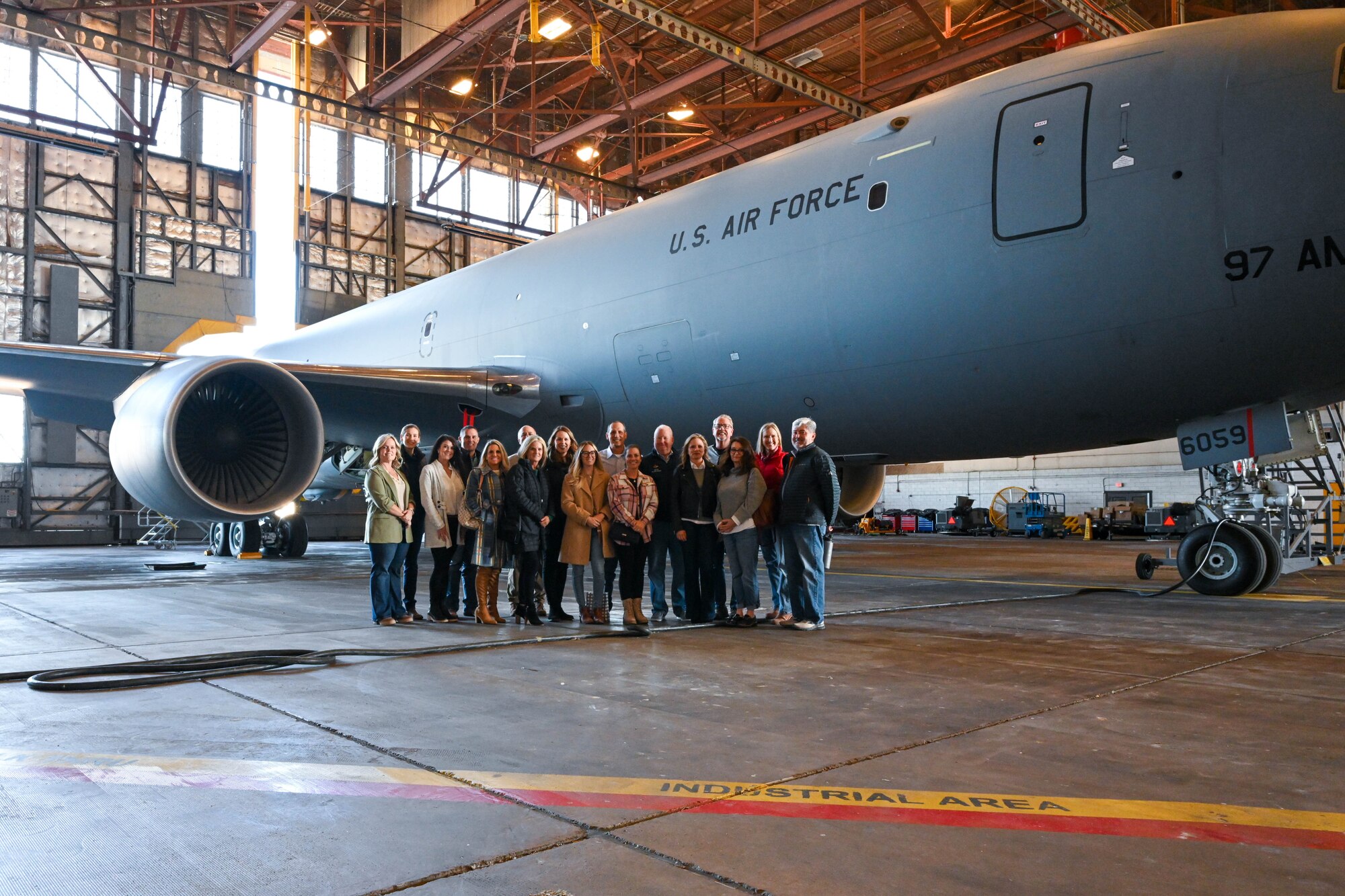Members of the Altus Military Affairs Committee take a photo in front of a KC-46 Pegasus during an orientation tour at Altus Air Force Base, Oklahoma, Nov. 2, 2023. The members toured multiple locations across the base. (U.S. Air Force photo by Senior Airman Miyah Gray)