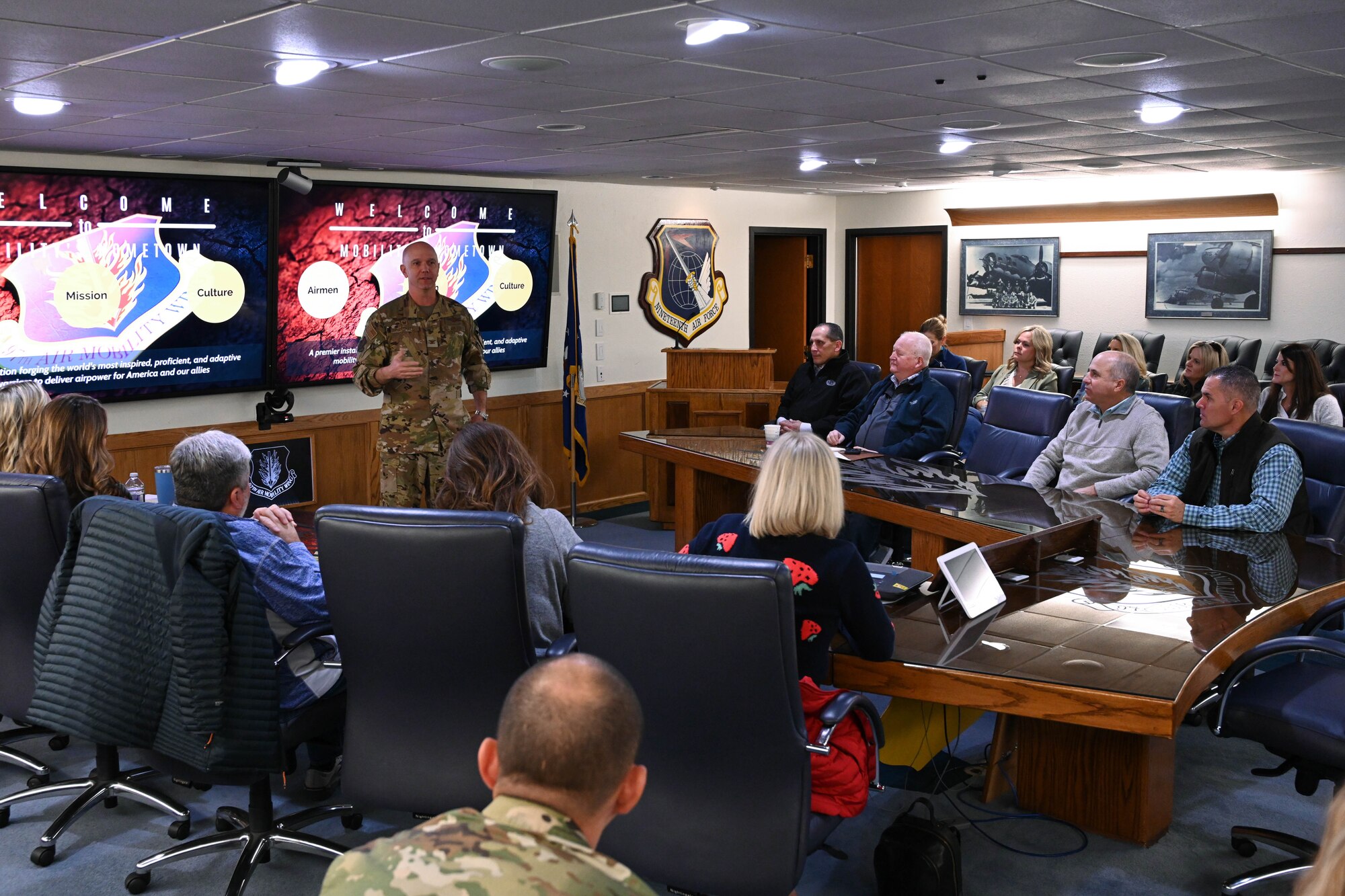 U.S. Air Force Col. Jeff Marshall, 97th Air Mobility Wing commander, greets members of the Altus Military Affairs Committee at Altus Air Force Base, Oklahoma, Nov. 2, 2023. Marshall gave a mission brief and answered commonly asked questions members have about the Air Force. (U.S. Air Force photo by Senior Airman Miyah Gray)