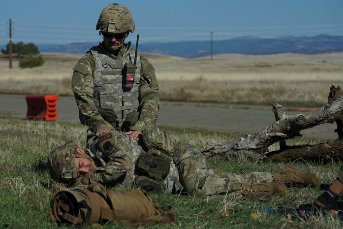 An Airman from the 9th Reconnaissance Wing conduct Tactical Combat Casualty Care (TCCC) to a simulated injured Airman during the Multi-Capable Airmen Tier-1 course Oct. 27, 2023, at Beale Air Force Base, California.