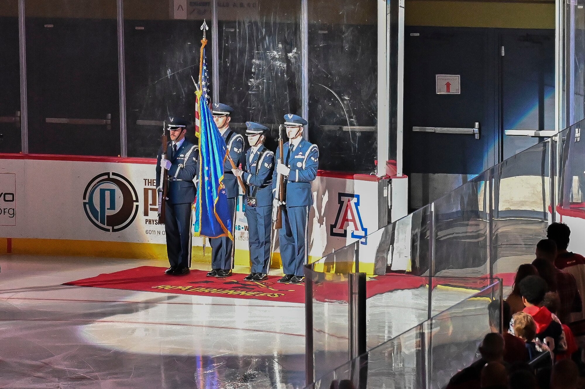 Pictured above is a group of Airmen holding various flags.