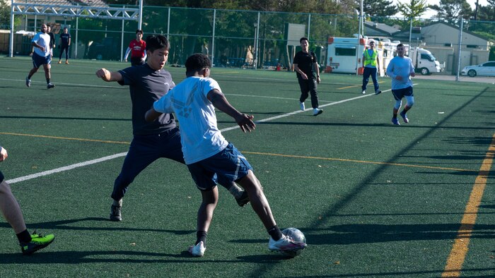 A Republic of Korea Air Force Airman defends against a U.S. Air Force Airman during a soccer exhibition match