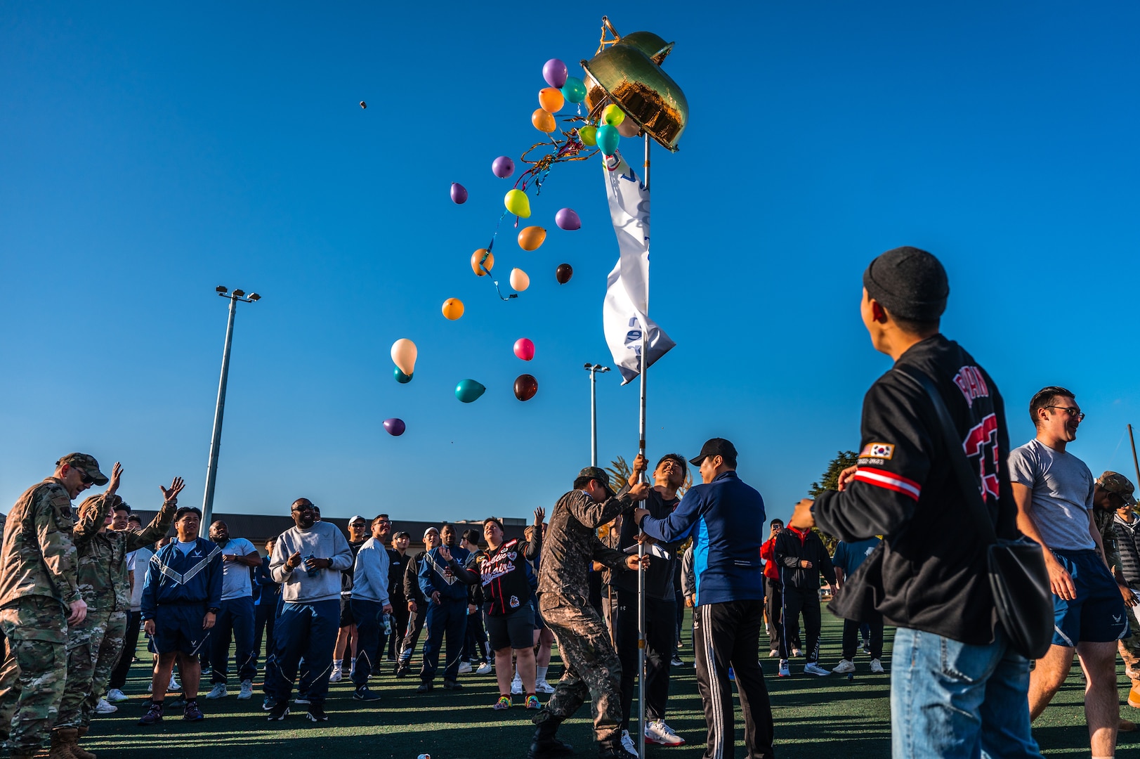 Airmen from the U.S. Air Force 8th Fighter Wing and Republic of Korea Air Force 38th Fighter Group break a gourd during the seventh annual Friendship Day