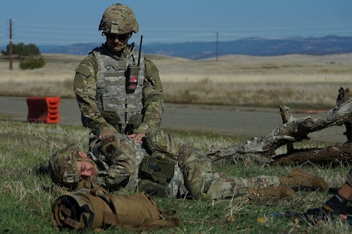 An Airman from the 9th Reconnaissance Wing conduct Tactical Combat Casualty Care (TCCC) to a simulated injured Airman during the Multi-Capable Airmen Tier-1 course Oct. 27, 2023, at Beale Air Force Base, California.
