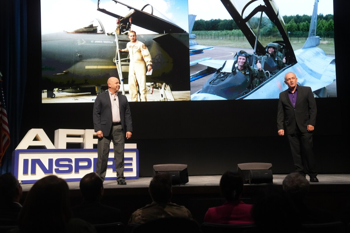 James “Sass” Bieryla, director of the Air Force Research Laboratory, or AFRL’s, Strategic Partnering Directorate, left, and Kevin Price, a computer analyst in AFRL’s Aerospace Systems Directorate, right, share their perspectives as former active-duty pilots in their speech “Amplifying Warfighter Culture” at the seventh annual AFRL Inspire event at the Air Force Institute of Technology’s Kenney Hall, Oct. 26, 2023. Bieryla and Price both lost friends in aircraft accidents, the pair acknowledged as they took the stage together to deliver the last talk of the afternoon. One way to bring military pilots home safely is to amplify warfighter culture, which means actively considering the perspective and experiences of Airmen and Guardians when making the decisions or developing the technologies that will directly affect them, Price said. (U.S. Air Force photo /Cherie Cullen)