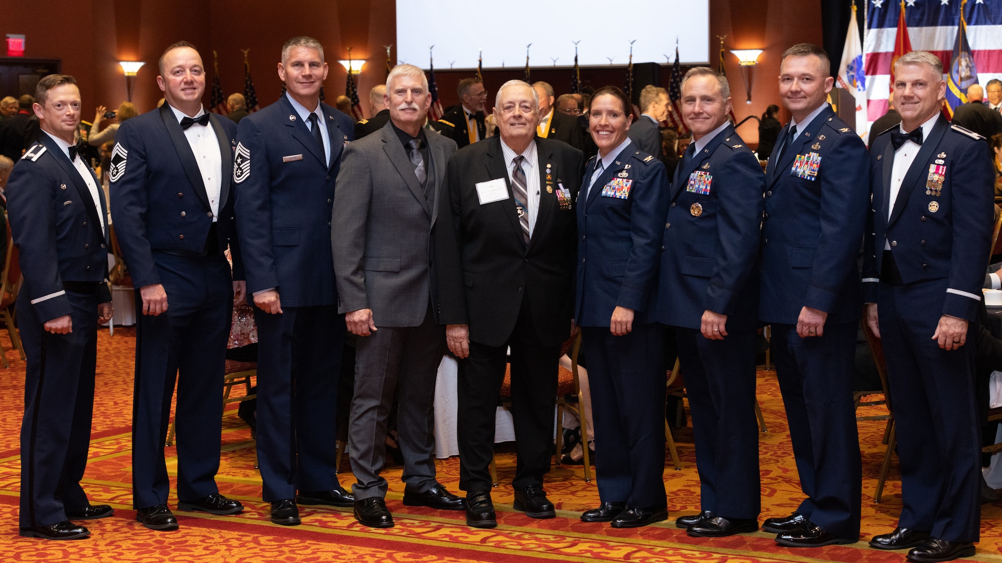 Men and women standing for group photo