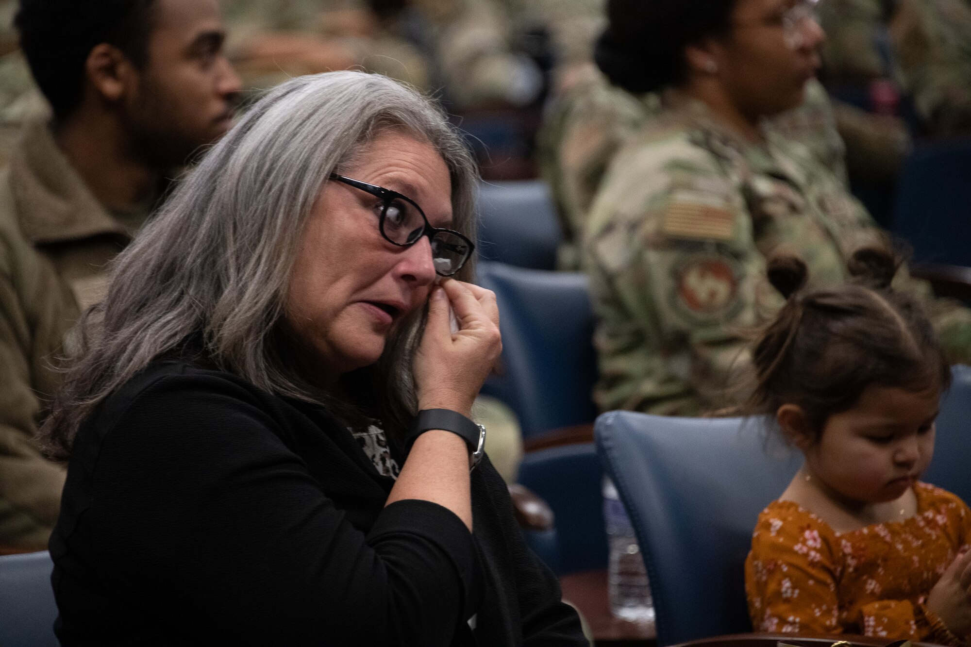Jackie West, U.S. Air Force Senior Airman Matthew B. West's mother, dries a tear during her son's Airman’s Medal presentation ceremony at Joint Base Andrews.
