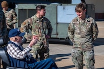 Senior Airman Ethan Bianucci, 2nd Maintenance Squadron aerospace ground equipment specialist, talks with retired Senior Master Sgt. John McNeece at Barksdale Air Force Base, La., October 18, 2023. McNeece was among the first generation of B-52 maintainers during his time in service from 1952 until 1975. (U.S. Air Force photo by Airman 1st Class Seth Watson)