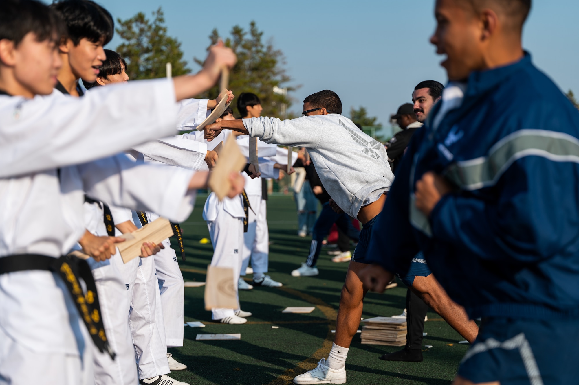8th Fighter Wing Airmen participate in a presentation from the Samcheonpo High School taekwondo team during the seventh annual Friendship Day