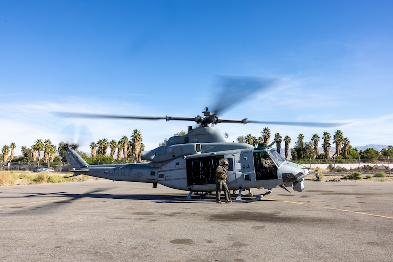U.S. Marines with Marine Light Helicopter Attack Training Squadron (HMLAT) 303, Marine Aircraft Group 39, 3rd Marine Aircraft Wing, conduct preflight checks on a UH-1Y Venom at Palm Springs International Airport, California, Nov. 5, 2023