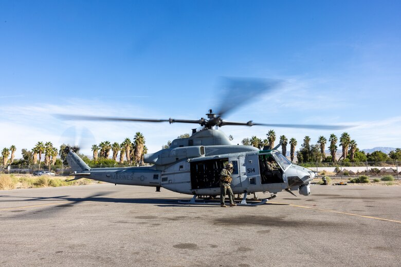 U.S. Marines with Marine Light Helicopter Attack Training Squadron (HMLAT) 303, Marine Aircraft Group 39, 3rd Marine Aircraft Wing, conduct preflight checks on a UH-1Y Venom at Palm Springs International Airport, California, Nov. 5, 2023