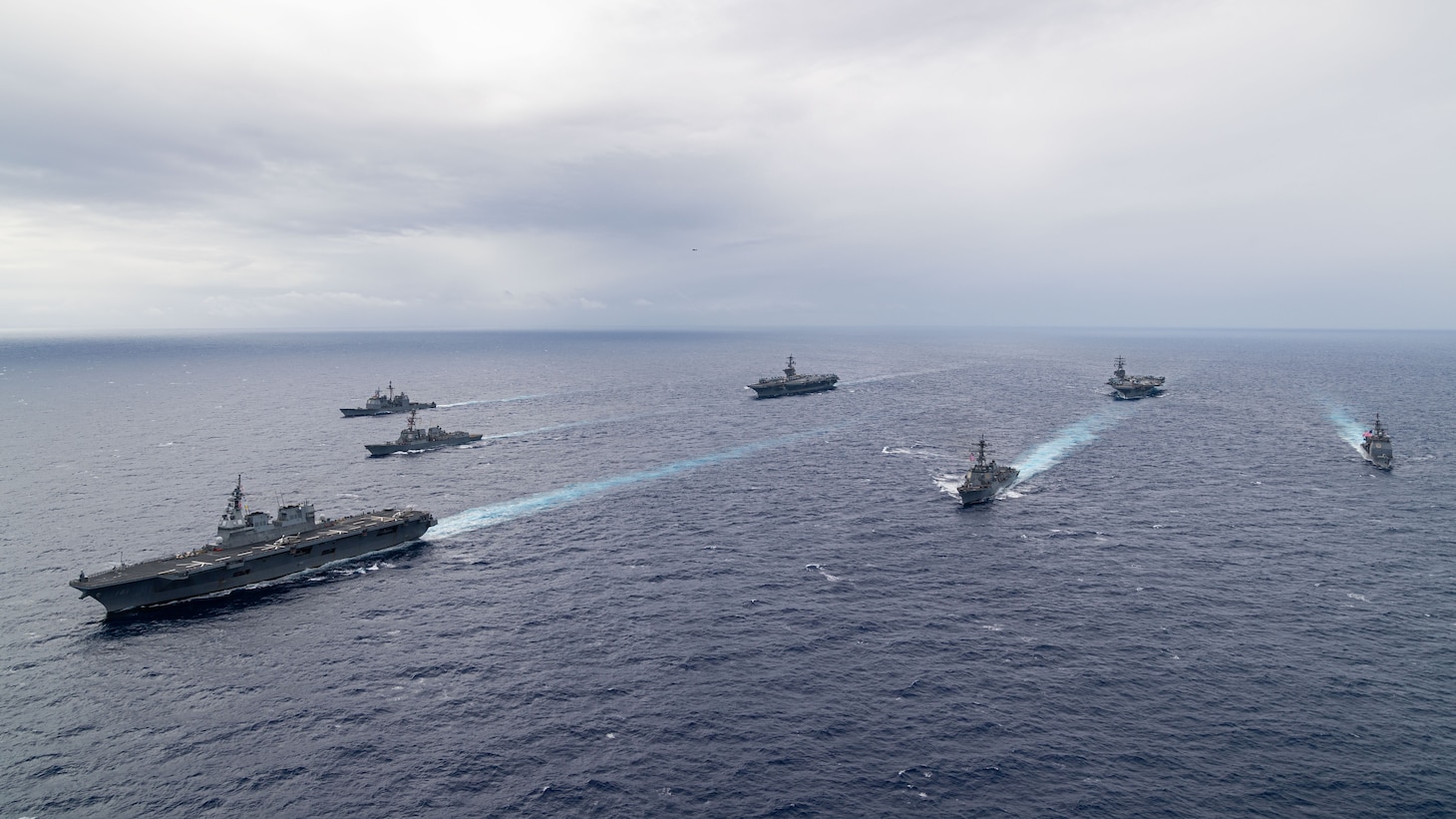 PHILIPPINE SEA (Nov. 7, 2023) Nimitz-class aircraft carriers, USS Ronald Reagan (CVN 76) and USS Carl Vinson (CVN 70), steam in formation with Japan Maritime Self-Defense Force (JMSDF) first-in-class helicopter destroyer, JS Hyuga (DDH 181), Ticonderoga-class guided-missile cruisers, USS Antietam (CG 54) and USS Robert Smalls (CG 62), and Arleigh Burke-class guided-missile destroyers, USS Sterett (DDG 104) and USS Kidd (DDG 100), during the Multi-Large Deck Exercise (MLDE) in the Philippine Sea, Nov. 7. Ronald Reagan is participating in the bilateral MLDE, which features the ships and aircraft of JMSDF Escort Flotilla 3, as well as the U.S. Navy’s Carrier Strike Group 1 and Carrier Strike Group 5. MLDE is a multi-domain event that grows the already strong partnership and interoperability that exists between the JMSDF and U.S. Navy today. (U.S. Navy photo by Mass Communication Specialist 3rd Class Timothy Dimal)