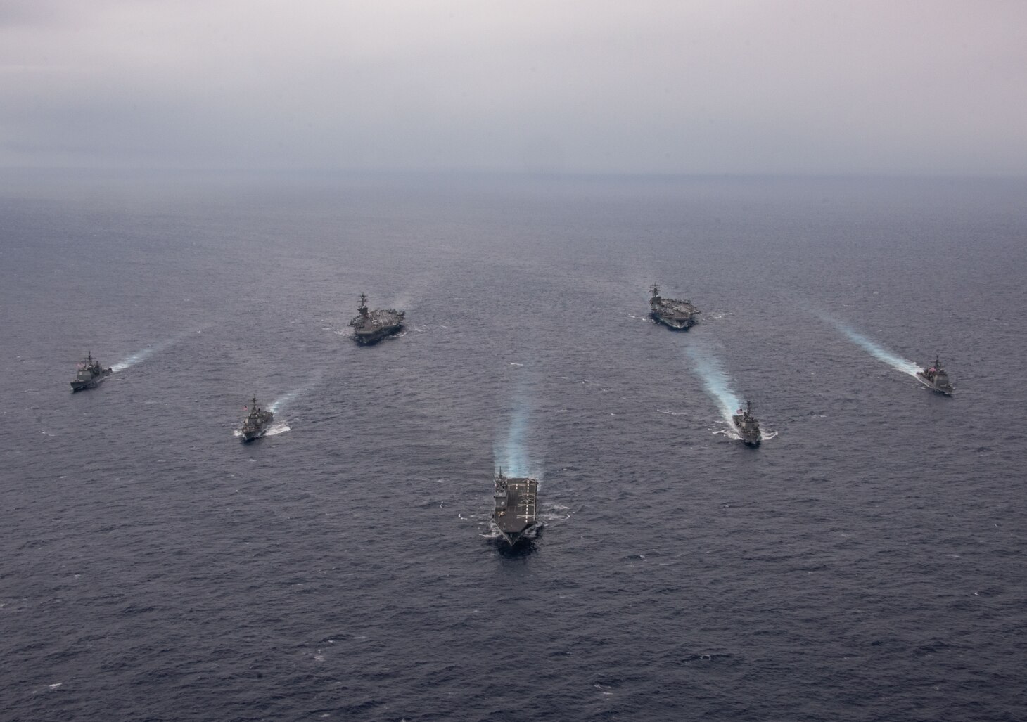 PHILIPPINE SEA (Nov. 7, 2023) Nimitz-class aircraft carriers, USS Ronald Reagan (CVN 76) and USS Carl Vinson (CVN 70), steam in formation with Japan Maritime Self-Defense Force (JMSDF) first-in-class helicopter destroyer, JS Hyuga (DDH 181), Ticonderoga-class guided-missile cruisers, USS Antietam (CG 54) and USS Robert Smalls (CG 62), and Arleigh Burke-class guided-missile destroyers, USS Sterett (DDG 104) and USS Kidd (DDG 100), during the Multi-Large Deck Exercise (MLDE) in the Philippine Sea, Nov. 7. Ronald Reagan is participating in the bilateral MLDE, which features the ships and aircraft of JMSDF Escort Flotilla 3, as well as the U.S. Navy’s Carrier Strike Group 1 and Carrier Strike Group 5. MLDE is a multi-domain event that grows the already strong partnership and interoperability that exists between the JMSDF and U.S. Navy today. (U.S. Navy photo by Mass Communication Specialist 3rd Class Natasha ChevalierLosada)