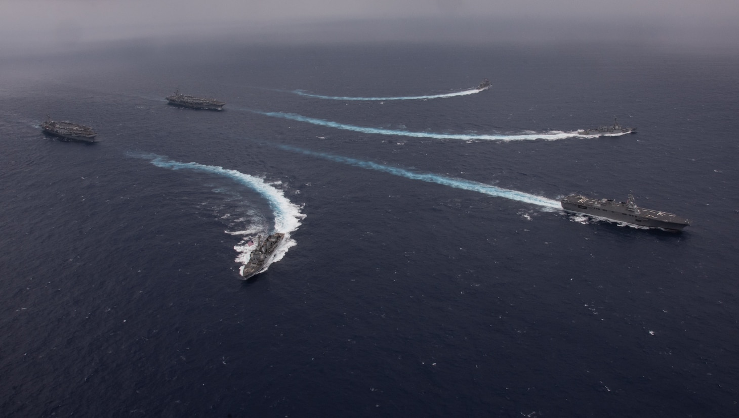 PHILIPPINE SEA (Nov. 7, 2023) Nimitz-class aircraft carriers, USS Ronald Reagan (CVN 76) and USS Carl Vinson (CVN 70), steam in formation with Japan Maritime Self-Defense Force (JMSDF) first-in-class helicopter destroyer, JS Hyuga (DDH 181), as Ticonderoga-class guided-missile cruisers, USS Antietam (CG 54) and USS Robert Smalls (CG 62), and Arleigh Burke-class guided-missile destroyers, USS Sterett (DDG 104) and USS Kidd (DDG 100), break away from formation during the Multi-Large Deck Exercise (MLDE) in the Philippine Sea, Nov. 7. Ronald Reagan is participating in the bilateral MLDE, which features the ships and aircraft of JMSDF Escort Flotilla 3, as well as the U.S. Navy’s Carrier Strike Group 1 and Carrier Strike Group 5. MLDE is a multi-domain event that grows the already strong partnership and interoperability that exists between the JMSDF and U.S. Navy today. (U.S. Navy photo by Mass Communication Specialist 3rd Class Natasha ChevalierLosada)