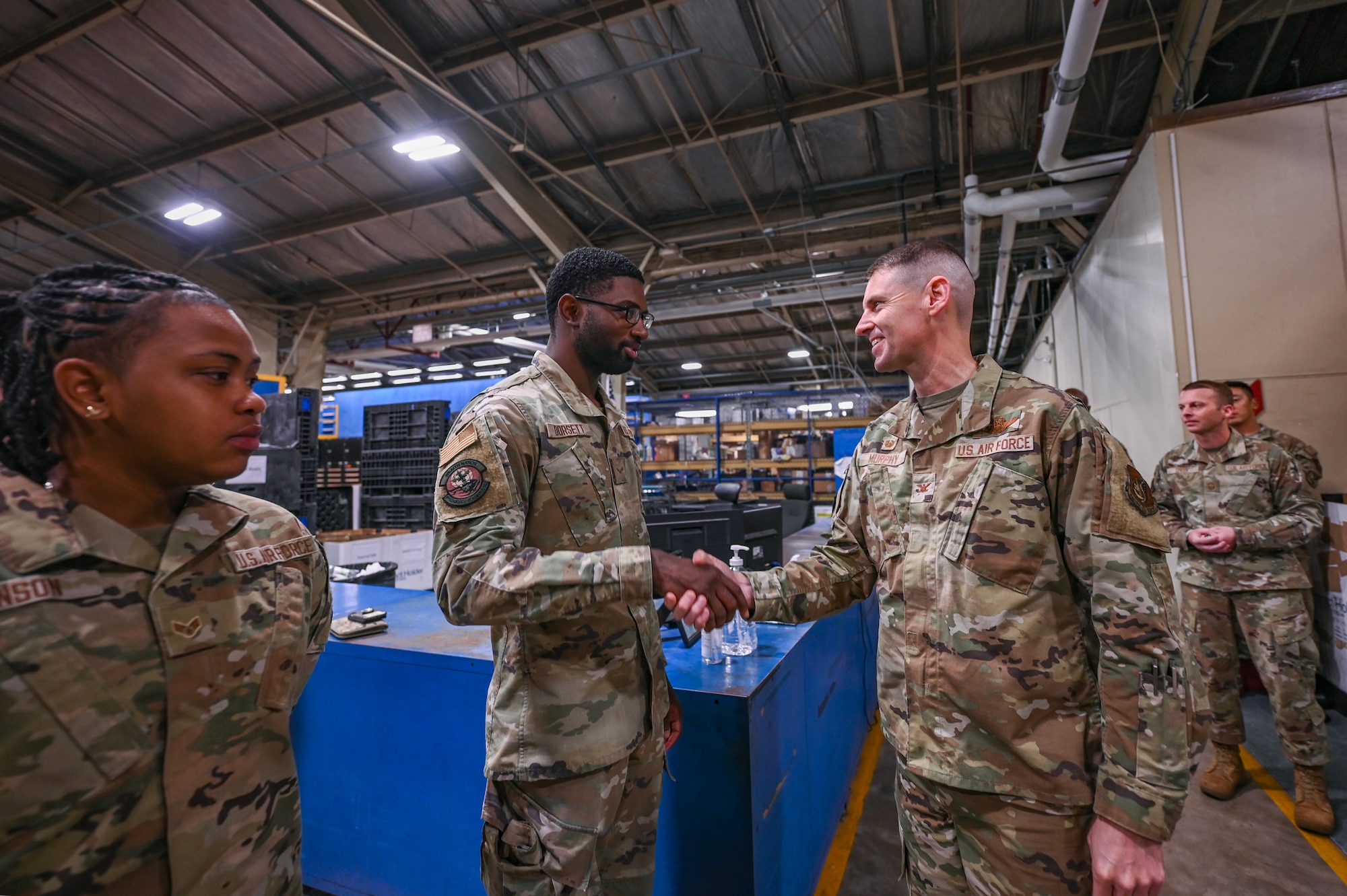 8th Fighter Wing commander coins Airman 1st Class Zion Dorsett