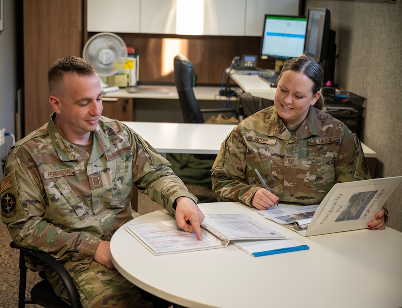 Master Sgt. Morgan McCoy, right, 171st Air Refueling Wing Financial Management Superintendent, and Master Sgt. Clint Ferringer, left, 171st ARW Financial Service Supervisor, pose for a photo at the 171st ARW near Pittsburgh, Nov. 5, 2023. (U.S. Air National Guard photo by Tech. Sgt. Michael Fariss)