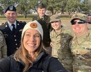 Melannie Covey, the proud mother of Illinois Army National Guard Spc. Hayden Covey takes a selfie with members of her son's unit, the 126th Quartermaster Company, prior to the Quincy (Illinois) Veterans Day Parade on Nov. 4.