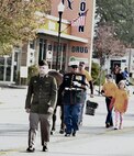 Illinois Army National Guard Private 1st Class Aden Trautvetter of the 126th Quartermaster Co. based in Quincy marches in the Quincy Veterans Day Parade on Nov. 4.