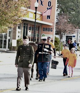 Illinois Army National Guard Private 1st Class Aden Trautvetter of the 126th Quartermaster Co. based in Quincy marches in the Quincy Veterans Day Parade on Nov. 4.