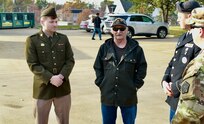 Army Veteran Bill Ross, who served in Beirut and Grenada, talks with Illinois Army National Guard Private 1st Class Aden Trautvetter (left), Sgt. Brent Clark, and Sgt. 1st Class Jason Sears prior to the Nov. 4 Quincy (Illinois) Veterans Day Parade.