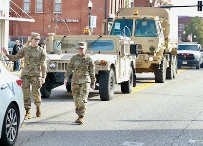 Illinois Army National Guard Cpl. Miah Sally (right) and Private 1st Class Breanne Kidd march in the Quincy (Illinois) Veterans Day Parade on Nov. 4.