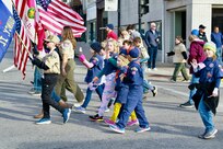 Boy Scouts and Cub Scouts march in the Quincy (Illinois) Veterans Day Parade on Nov. 4.