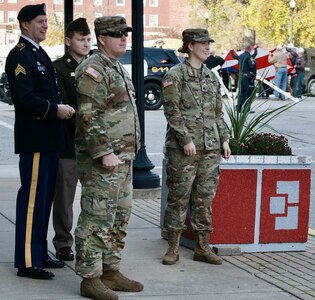 From right, Illinois Army National Guard Sgt. Madison Harmon, Sgt. 1st Class Jason Sears, Private 1st Class Aden Trautvetter, and Sgt. Brent Clark watch their fellow Soldiers in the Quincy (Illinois) Veterans Day Parade on Nov. 4.