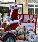 The Marine Corps Toys for Tots Santa Claus waves to the crowd during the Quincy (Illinois) Veterans Day Parade on Nov. 4. Illinois Army National Guard's 126th Quartermaster Co. based in Quincy had military vehicles and multiple Soldiers participate in the annual parade.
