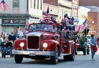 An antique fire truck takes part in the Quincy (Illinois) Veterans Day Parade on Nov. 4. The Illinois Army National Guard's 126th Quartermaster Co. based in Quincy had military vehicles and multiple Soldiers participate in the annual parade.
