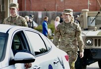 Illinois Army National Guard Private 1st Class Breanne Kidd and Private Drew Tipton-Hicks march in the Quincy (Illinois) Veterans Day Parade on Nov. 4. The 126th Quartermaster Co. based in Quincy had military vehicles and multiple Soldiers participate in the annual parade.