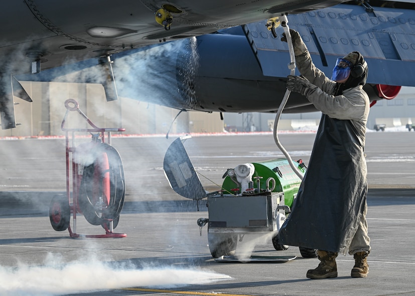 Airman 1st Class Seth Quillen, 5th Aircraft Maintenance Squadron crew chief, connects a liquid oxygen (LOX) hose to a B-52H Stratofortress at Minot Air Force Base, North Dakota, Nov. 2, 2023. The aircraft’s systems convert LOX into a gaseous form, providing oxygen to the aircrew during flight. (U.S. Air Force photo by Airman 1st Class Kyle Wilson)