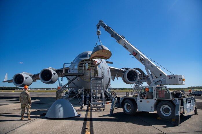 U.S. Air Force crew chiefs with the 437th Aircraft Maintenance Squadron attach a new nose to a C-17 Globemaster III at Joint Base Charleston, South Carolina, Sept. 17, 2023.