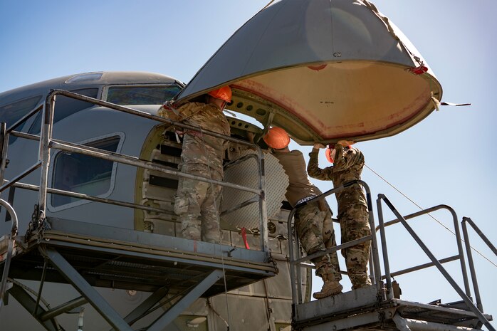 U.S. Air Force crew chiefs with the 437th Aircraft Maintenance Squadron attach a new nose to a C-17 Globemaster III at Joint Base Charleston, South Carolina, Sept. 17, 2023.
