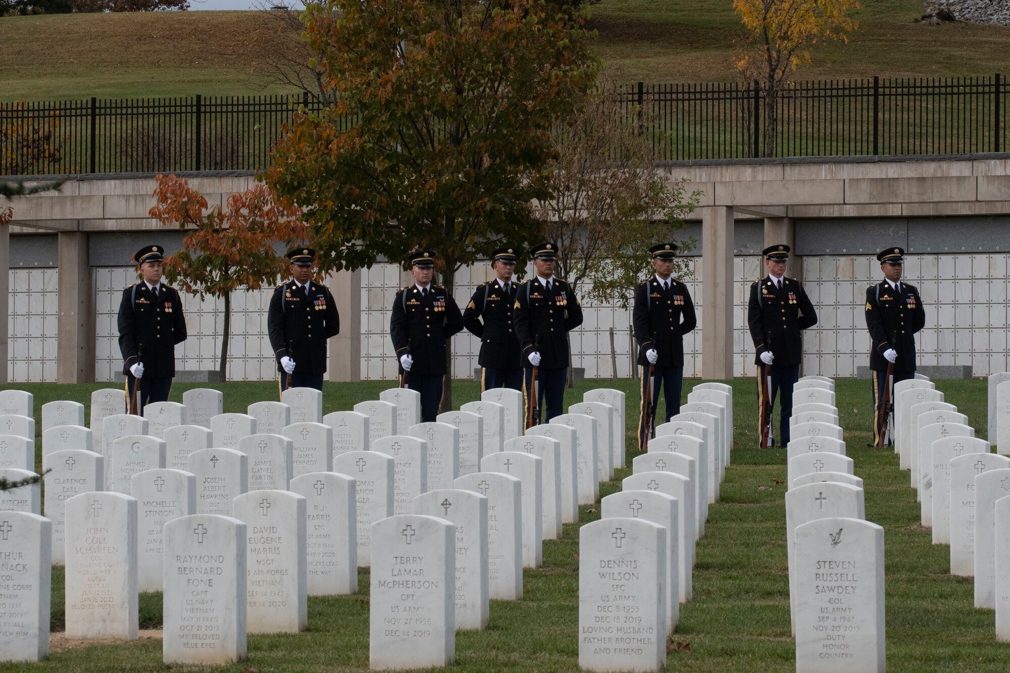 Honor guardsmen stand ready to fire blank volleys.