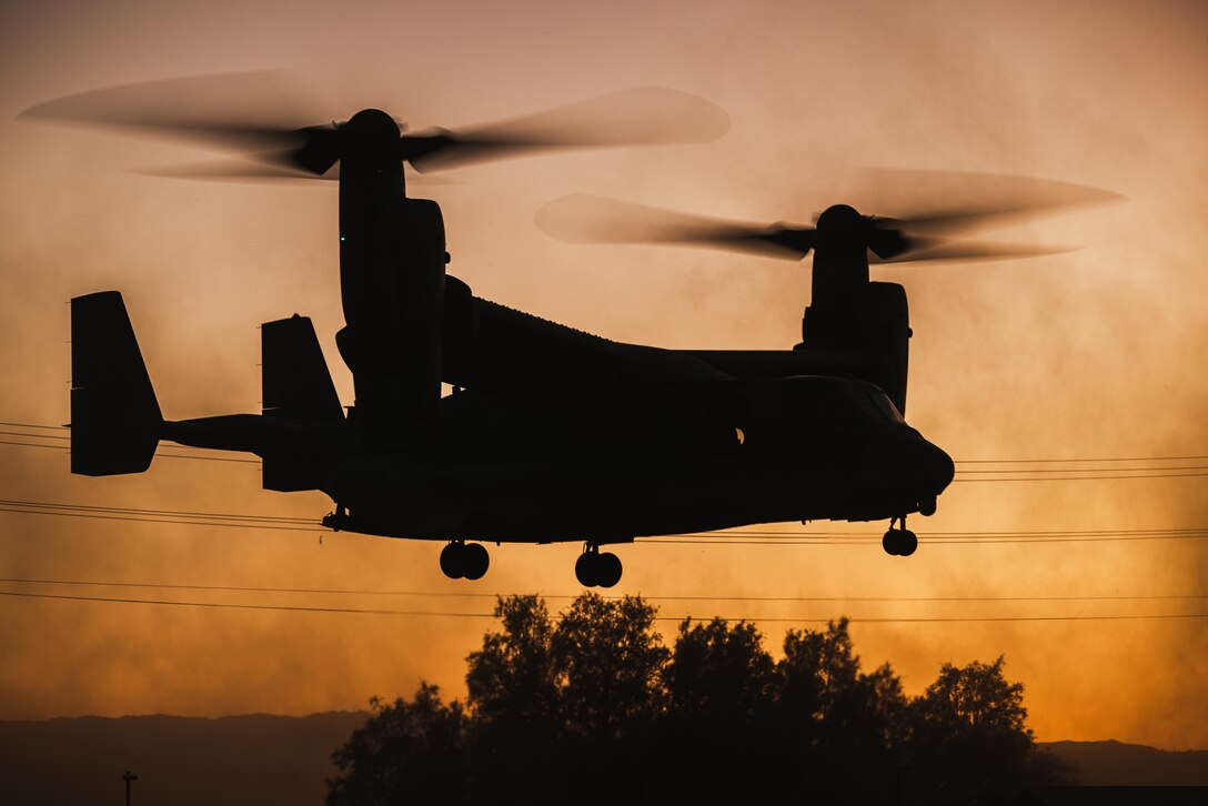 A U.S. Marine Corps MV-22B Osprey aircraft with Marine Aviation Weapons and Tactics Squadron One, prepares to land during a noncombatant evacuation operation exercise as part of Weapons and Tactics Instructor Course 1-24 at Marine Corps Air-Ground Combat Center, Twentynine Palms, California, Oct. 20, 2023. WTI, hosted by MAWTS-1, is a seven-week course providing standardized advanced tactical training and certification of unit instructor qualifications to support Marine aviation training and readiness. The NEO allows the prospective WTIs to plan, brief, and execute while shifting their focus towards an in-depth review and dissection of rules of engagement, military authorities, and civil considerations. (U.S. Marine Corps photo by Lance Cpl. Justin J. Marty)