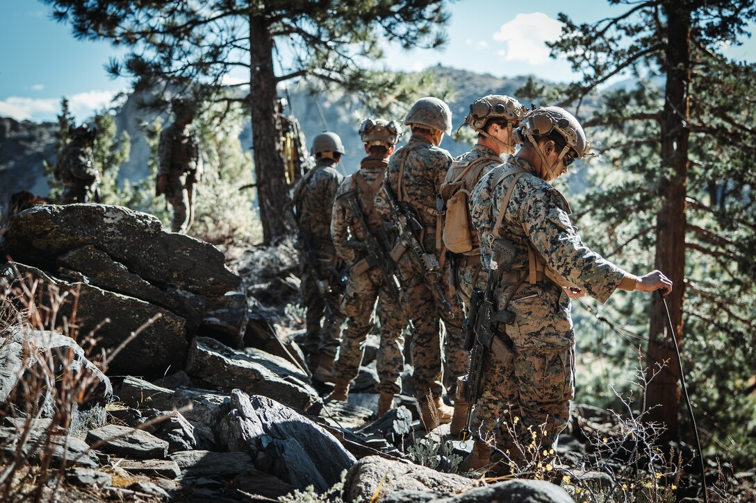 U.S. Marines with 2nd Battalion, 5th Marine Regiment, 1st Marine Division, pull equipment up a cliff using rope techniques during a simulated cliff assault as part of Mountain Exercise 1-24 at Marine Corps Mountain Warfare Training Center, Bridgeport, California, Oct. 20, 2023. MCMWTC specializes in mountain warfare training, providing a unique and ideal opportunity to rehearse operations in a mountainous environment. (U.S. Marine Corps photo by Lance Cpl. Richard PerezGarcia)
