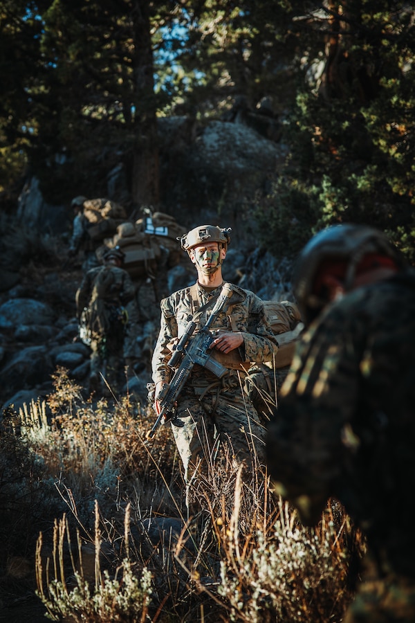 U.S. Marines with 2nd Battalion, 5th Marine Regiment, 1st Marine Division, patrol during a simulated cliff assault during Mountain Exercise 1-24 at Marine Corps Mountain Warfare Training Center, Bridgeport, California, Oct. 20, 2023. MCMWTC specializes in mountain warfare training, providing a unique and ideal opportunity to rehearse operations in a mountainous environment. (U.S. Marine Corps photo by Lance Cpl. Richard PerezGarcia)