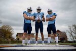 Members of the U.S. Coast Guard Academy Football team honor Douglas Munro with a new uniform. Douglas Munro, the U.S. Coast Guard's only Medal of Honor recipient, was posthumously awarded by President Franklin D. Roosevelt who presented the medal to Munro’s parents in the spring of 1943.(U.S. Coast Guard Video by Petty Officer 2nd Class Taylor Bacon)