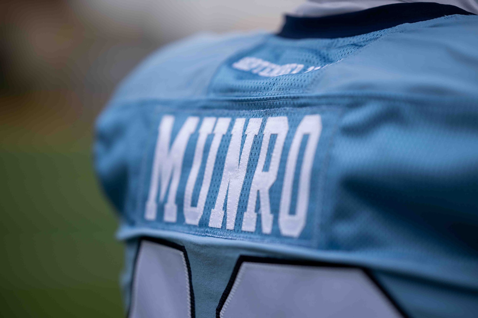 Members of the U.S. Coast Guard Academy Football team honor Douglas Munro with a new uniform. Douglas Munro, the U.S. Coast Guard's only Medal of Honor recipient, was posthumously awarded by President Franklin D. Roosevelt who presented the medal to Munro’s parents in the spring of 1943.(U.S. Coast Guard Video by Petty Officer 2nd Class Taylor Bacon)