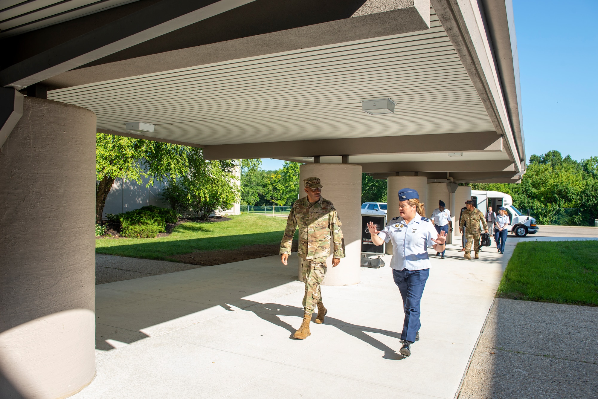 Air Force Chief of Staff Gen. CQ Brown, Jr. walks with Col. Ariel G. Batungbacal, NASIC commander, into NASIC headquarters at Wright-Patterson Air Force Base, Ohio, July 31, 2023. During his visit Brown and Batungbacal, along with other NASIC leadership, attended various air, space, cyber threat and intelligence briefs, concluding with recognizing the contributions of top NASIC employees.