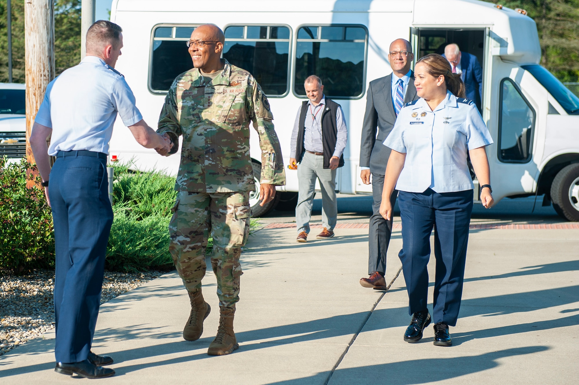 Air Force Chief of Staff Gen. CQ Brown, Jr. and Col. Ariel G. Batungbacal, National Air and Space Intelligence Center commander greet Col. Brian McCreary, Global Exploitation Intelligence Group commander, at Wright-Patterson Air Force Base, Ohio, July 31, 2023. During his visit, Brown toured the facility and received a series of intelligence briefings led by NASIC subject matter experts.