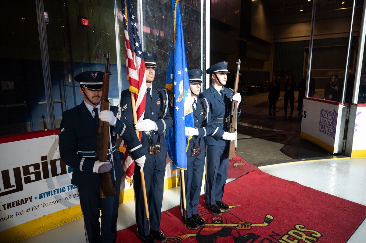 The 355th Wing Honor Guard presents the colors at a Tucson Roadrunners hockey game in Tucson, Ariz., Nov. 4, 2023. The Honor Guard’s presence at the game promoted DM’s connection to the Tucson community. (U.S. Air Force photo by Airman 1st Class Robert Allen Cooke III)